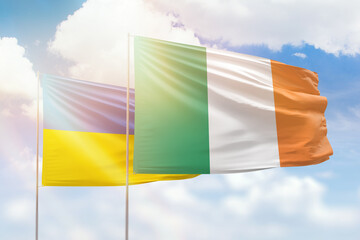 Sunny blue sky and flags of ireland and ukraine