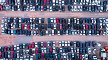 Yard of abandoned cars and seized for irregularity by the police. With many cars and many motorcycles parked. Aerial view