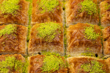 Turkish or arabic sweet dessert, baklava made from filo pastry, filled with chopped pistachio nuts and sweetened with syrup or honey.