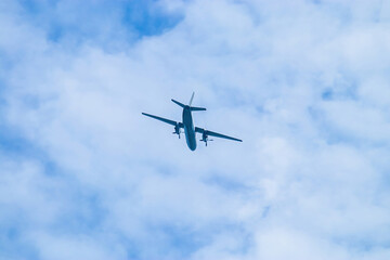 Fototapeta na wymiar Airplane in blue sky. Air cargo transportation. Plane is flying