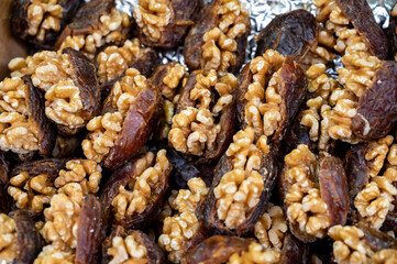 Turkish or arabic sweet dessert, ripe dried dadels with walnuts sweetened with syrup or honey.