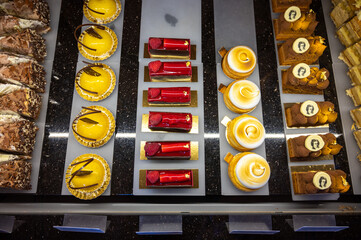 Austrian desserts, different types of chocolate and fruit cakes in cafe in Vienna.
