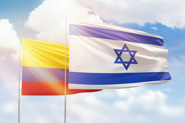 Sunny blue sky and flags of israel and colombia