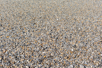 Galets sur la plage, au soleil.