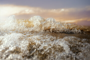 Close up of water wave splashing and foam bubble.