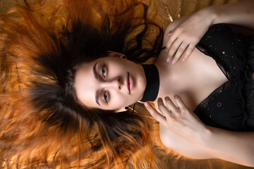 beauty portrait of a girl with red hair.