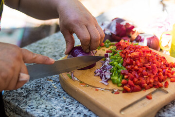 Farmer woman cooking outdoors in nature happily