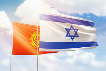 Sunny blue sky and flags of israel and kyrgyzstan