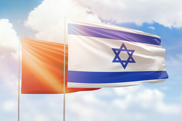 Sunny blue sky and flags of israel and morocco