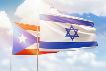 Sunny blue sky and flags of israel and puerto rico