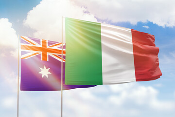 Sunny blue sky and flags of italy and australia