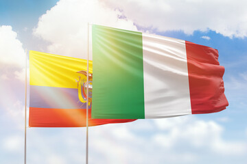 Sunny blue sky and flags of italy and ecuador