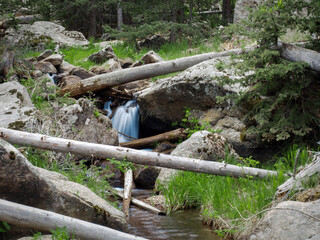 Waterfall Framed by Logs