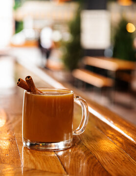 cider with cinnamon stick garnish