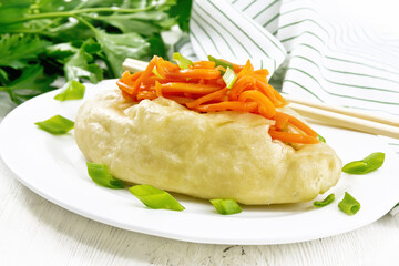 Pegodi with spicy carrots in plate on white board