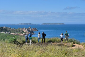 People visiting the pink granite coast in brittany-France