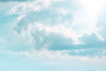 Sky. clouds and sun rays in a light blue sky.Beautiful heavenly wallpaper in blue tones.sky is in very light pastel colors. Heaven background.
