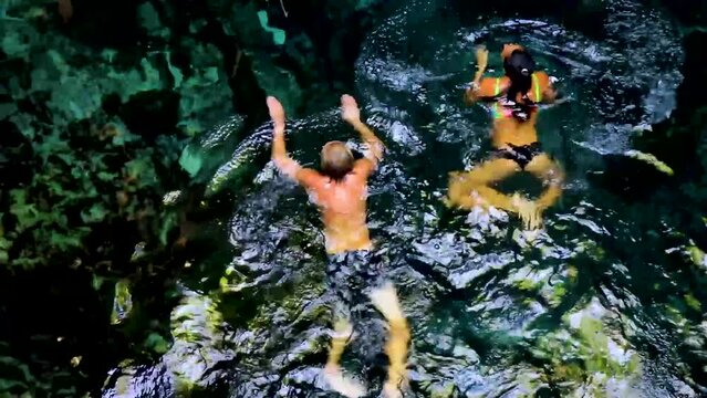 Sexy Couple Blue Turquoise Water Limestone Cave Sinkhole Cenote Mexico.