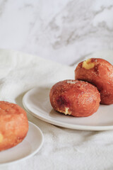 Doughnuts with Creamy Lemon Filling Dusted on white background. copy space for your text. Snack food and dessert.