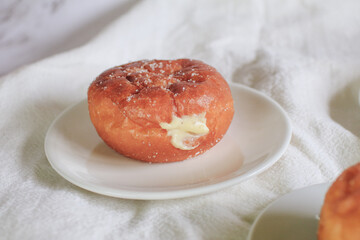 Doughnuts with Creamy Lemon Filling Dusted on white background. copy space for your text. Snack food and dessert.