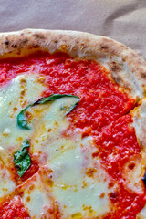 Pizza Margherita on rustic wooden table