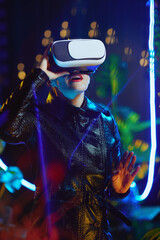 modern woman in metaverse in vr headset