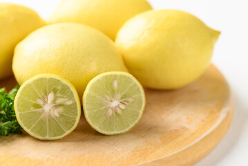 Lemon fruit and lime on wooden board, Citrus fruit