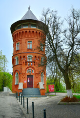 Fototapeta na wymiar Brick water tower in spring
