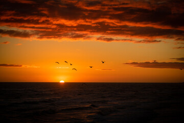 The sun goes down over the ocean at Otaki Beach, North Island, New Zealand
