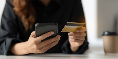Woman using online payment and holding credit card. Online Shopping concept.