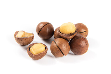 Shelled and unshelled macadamia nuts isolated on white background