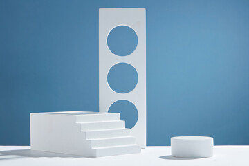 Front view of white podium and stairway with blank space in blue background abstract content