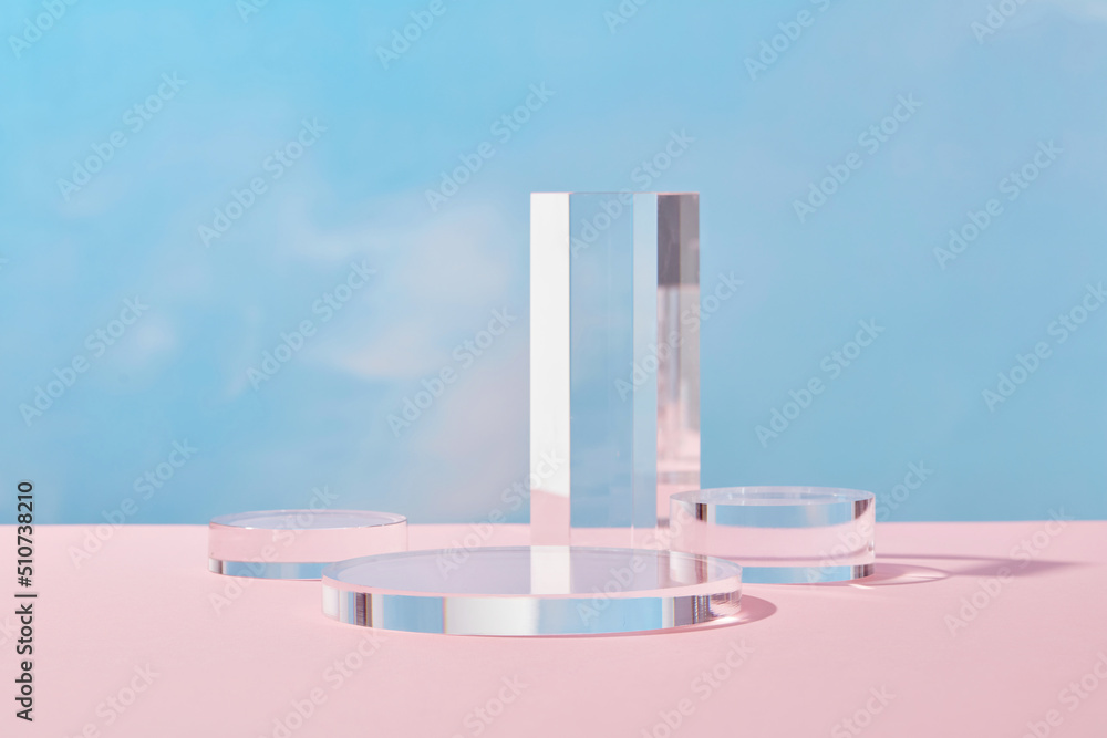 Wall mural front view of transparent podium with blank space in blue background abstract content