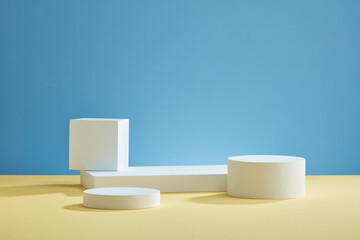 Front view of white podium with blank space in blue background abstract content
