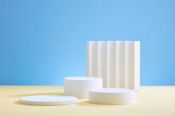 Front view of white podium with blank space in blue background abstract content