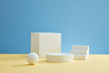 Front view of white podium with blank space in blue background abstract content