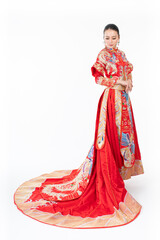 Portrait of a young asian Chinese female lady model wearing red traditional vintage wedding costume smiling and posing with different poses and gestures 