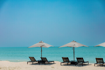 Sunbed with background of sandy beach and clear sky with nobody and copy space in Phuket area, Thailand