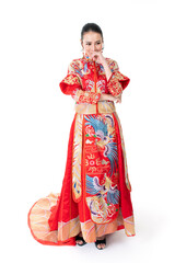 Portrait of a young asian Chinese female lady model wearing red traditional vintage wedding dress costume smiling and posing with different poses and gestures 