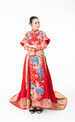 Portrait of a young asian Chinese female lady model wearing red traditional vintage wedding dress costume smiling and posing with different poses and gestures 