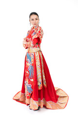 Portrait of a young asian Chinese female lady model wearing red traditional vintage wedding dress costume smiling and posing with different poses and gestures 