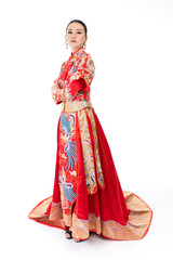 Portrait of a young asian Chinese female lady model wearing red traditional vintage wedding dress costume smiling and posing with different poses and gestures 