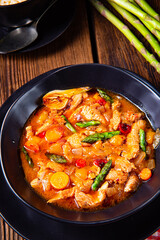 colorful turkey fricassee with asparagus and paprika