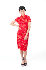 Portrait of a young asian Chinese female lady model wearing red traditional vintage costume Cheongsam smiling and posing with different poses and gestures 