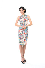 Portrait of a young asian Chinese female lady model wearing a patterned traditional vintage costume Cheongsam smiling and posing with different poses and gestures 