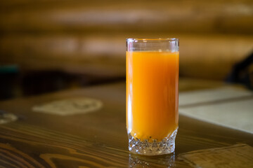 Fresh Orange Juice On Wooden Table In Cafe