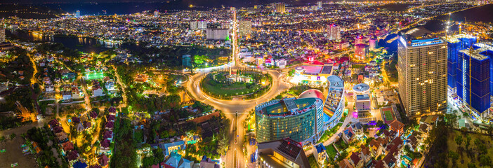 Panoramic coastal Vung Tau view from above, with traffic roundabout, house, Vietnam war memorial in...