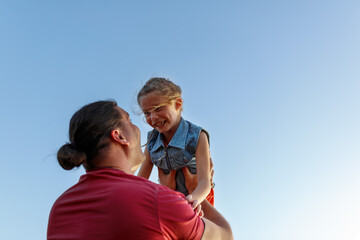 Happy father and child daughter spending time outdoors. Fathers Day.