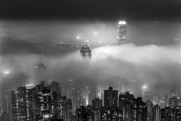 Fototapeta na wymiar Skyline of Victoria harbor of Hong Kong city in fog