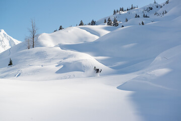 Snowmachine rider in Alaska backcountry
